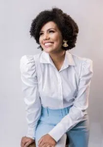 smiling woman wearing white shirt teacher